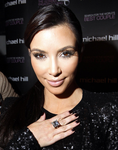 Kim Kardashian models a 22 karat princess cut diamond ring