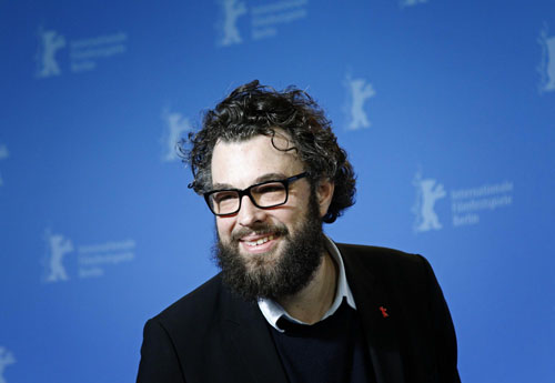 Director Schomburg poses with cast members during photocall at the Berlin Film Festival