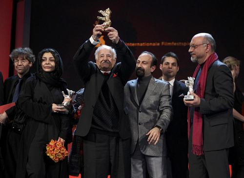 Members of the film 'Jodaeiye Nadar Az Simin'receive the Golden Bear aword for best film