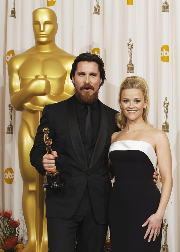 Actor Christian Bale reacts after winning the Oscar for Performance by an Actor