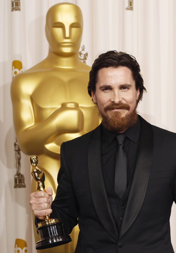 Actor Christian Bale reacts after winning the Oscar for Performance by an Actor