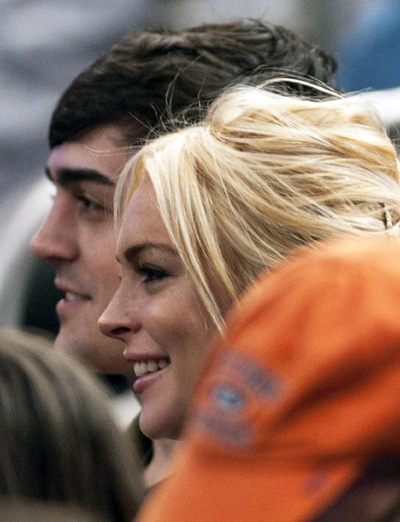 Lindsay Lohan watches NBA basketball game