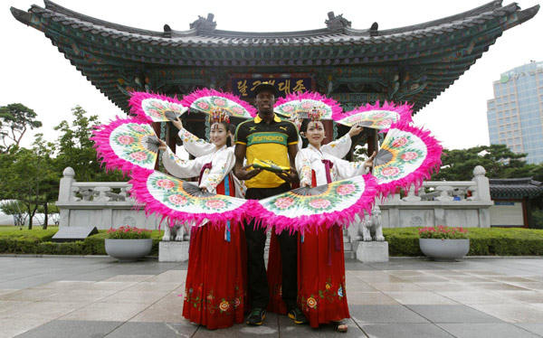 Jamaica poses wearing traditional Hanbok in Daegu