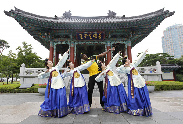 Jamaica poses wearing traditional Hanbok in Daegu