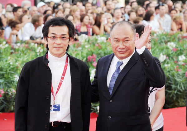 John Woo and Huang Shengyi arrive in Venice