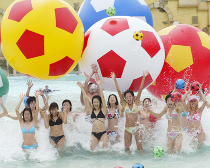 South Korean models pose with soccer balls during a promotional drive wishing South Korean soccer team's success in the 2006 Germany World Cup at Caribbean Bay swimming pool in South Korea's largest amusement park Everland in Yongin, about 50 km (31 miles) south of Seoul, May 11, 2006.