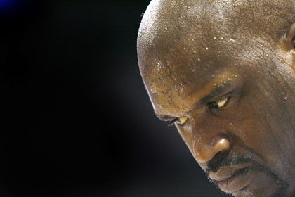 Miami Heat center Shaquille O'Neal looks down against the Detroit Pistons during their NBA Eastern Conference Finals Game 3 playoff match-up in Miami, Florida, May 27, 2006. O'Neal had 27 points as the Heat defeated the Pistons 98-83 to take a 2-1 series lead. 