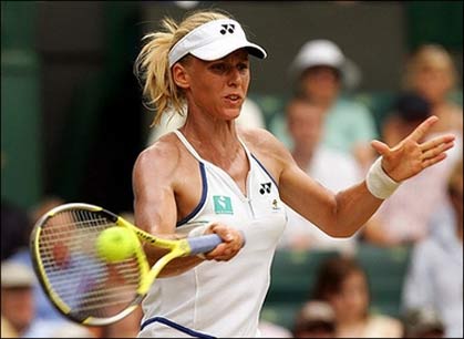 Elena Dementieva of Russia returns the ball to her compatriot Maria Sharapova during the quarter-finals of the Wimbledon Tennis Championships. Sharapova beat Dementieva after a streaker inturrupted their match.[AFP]