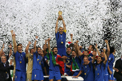 Italy's Fabio Cannavaro lifts the World Cup Trophy after the World Cup 2006 final soccer match between Italy and France in Berlin July 9, 2006. [Reuters]