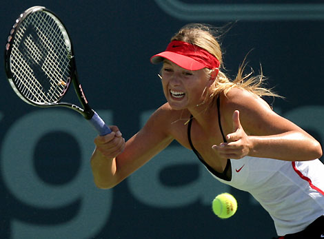 Russia's Maria Sharapova hits a forehand to France's Marion Bartoli during the JPMorgan Chase Open women's tennis tournament in Carson, California, August 10, 2006. 