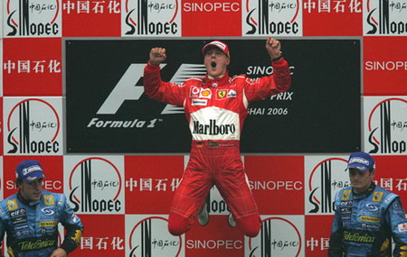 Ferrari F1 driver Michael Schumacher of Germany celebrates on the podium after winning the 