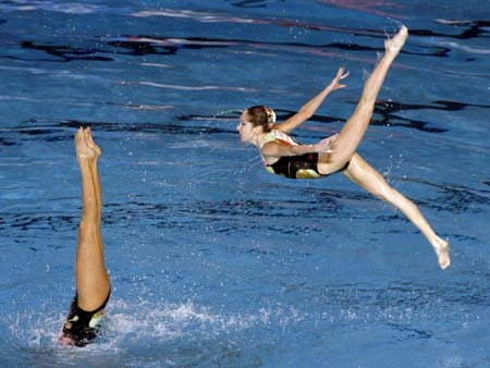 Members of the Ukrainian team perform in the synchronised swimming free combination routine preliminary round at the World Aquatics Championships at Rod Laver Arena in Melbourne March 17, 2007. 