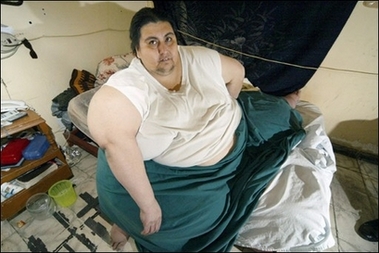 Mexican Manuel Uribe -- who tips the scales at 560 kilograms (1,234 pounds) -- is seen here in 2006. He will be listed as the world's fattest man by the Guinness Book of Records, while a loss of 200 kilos (440 pounds) may make him the man who lost the most weight.[AFP]