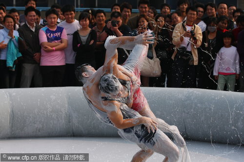 Mud wrestling contest in Hainan