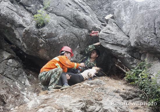 Woman dies after getting stuck in rocks