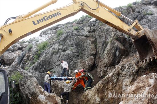 Woman dies after getting stuck in rocks