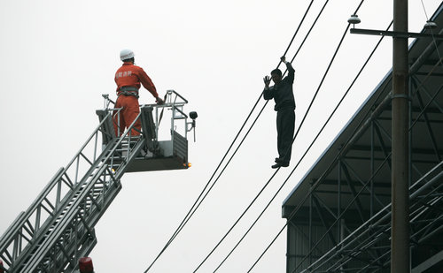 High-tension wire standoff ends after 23 hours