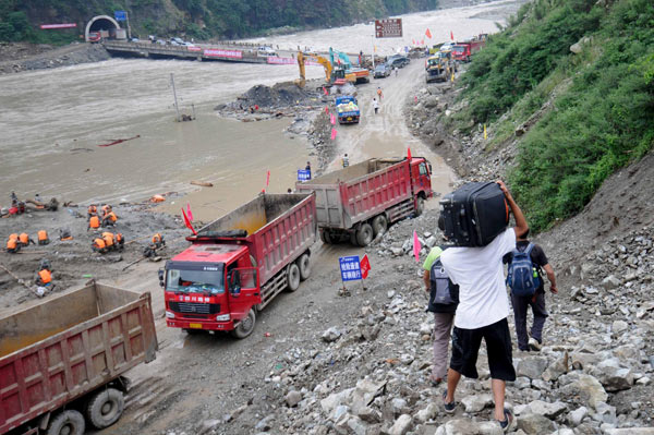 Buried road forces people to climb mountains