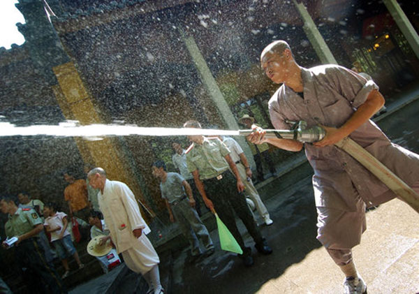 Monks test their firefighting skills