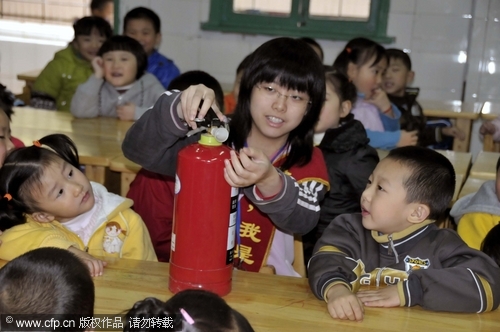 Preschool children practice fire drill