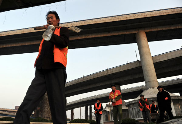 Migrant workers make their home under overpass