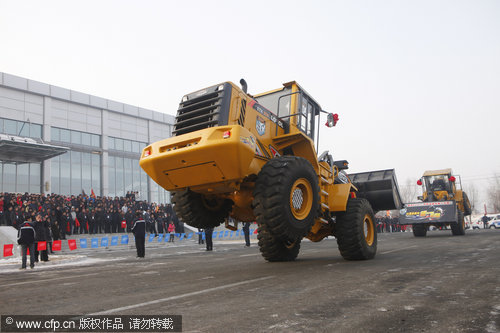 Loader performs break-dance stunts