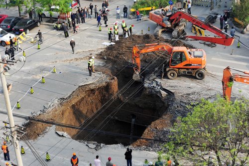 Road caves in, swallowing truck