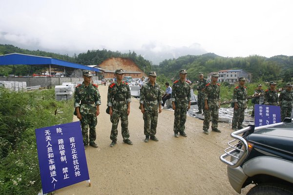 Flood and mudslide kill 29 in Central China