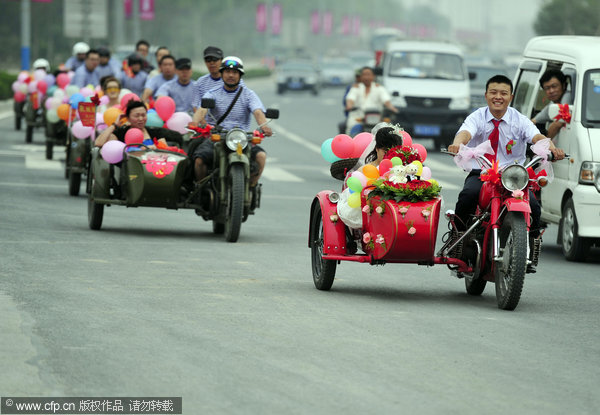 The blushing bride on a motorbike