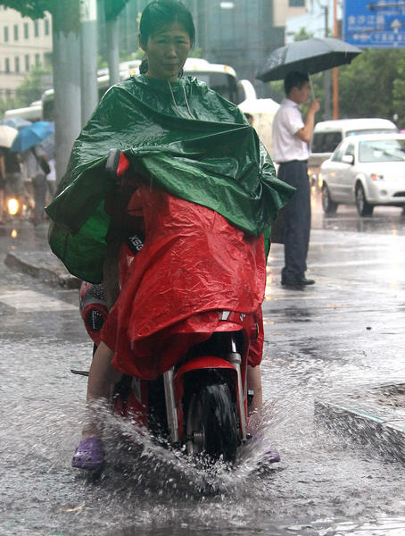 Heavy rain hits downtown Shanghai