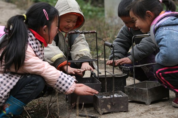 Burning charcoal to warm school run