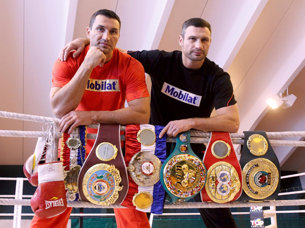 Mighty brothers show off trophy before fight