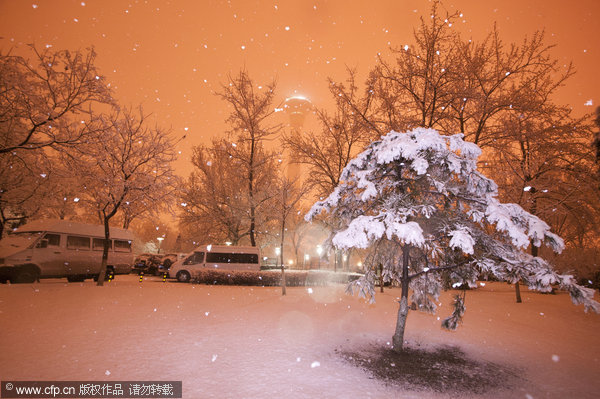 Spring snow blankets Beijing