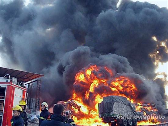 One dead after eight trucks blaze