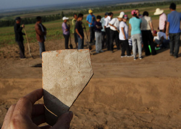 5,300-year-old pottery statue found in N China