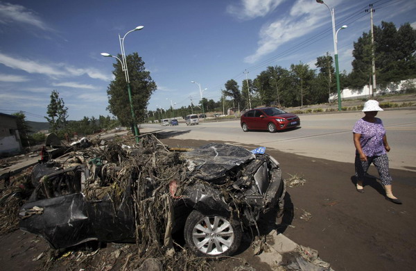 Deadly storm leaves 15,000 cars damaged