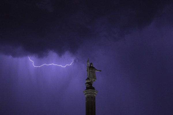 Lightning illuminates Madrid's Colon Square