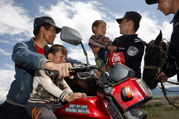 Police patrol on horseback in Xinjiang