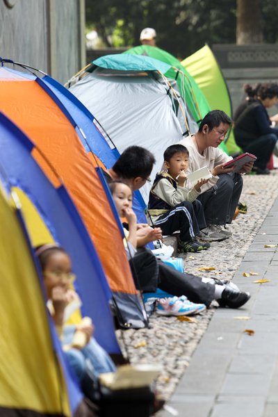 Parents pitch tents for school break time