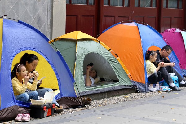 Parents pitch tents for school break time