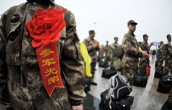 New recruits march off to a new life