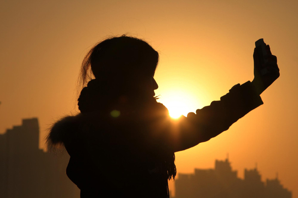 Enjoying sunrise on New Year's Day in China