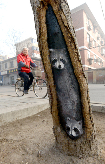 Tree hole art a treat for passers-by