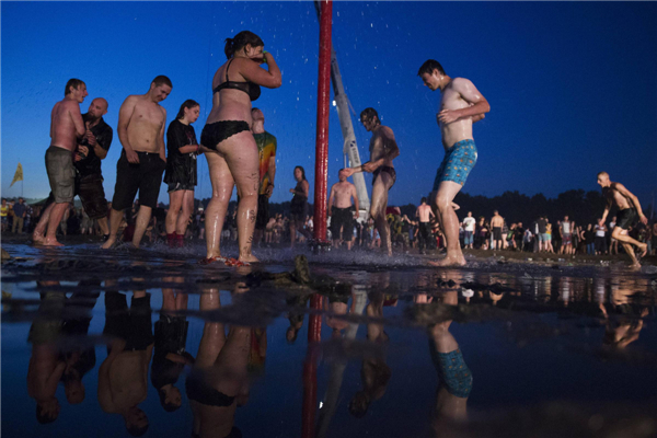 Woodstock revellers embrace music and mud