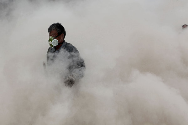 Hard, dusty labor in sweltering times