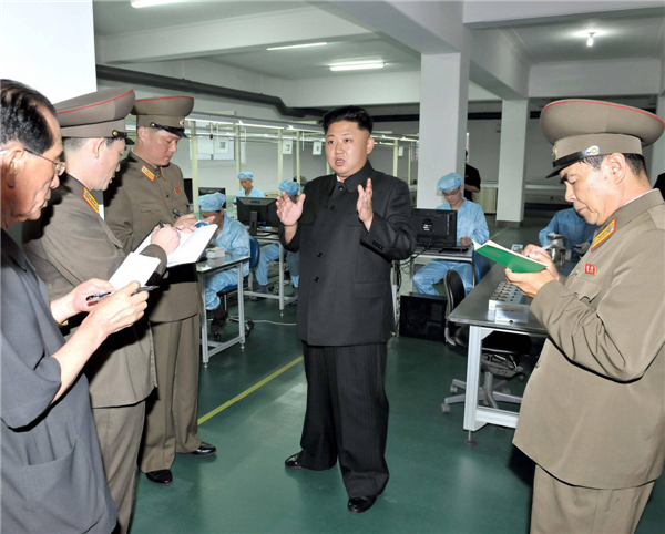 Kim Jong-un visits mobile phone factory