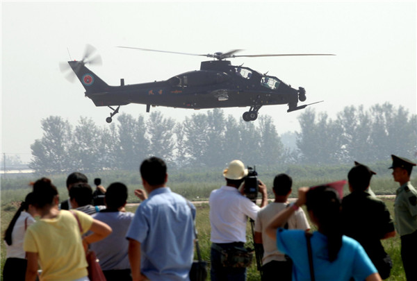 Helicopters practice acrobatic moves for expo