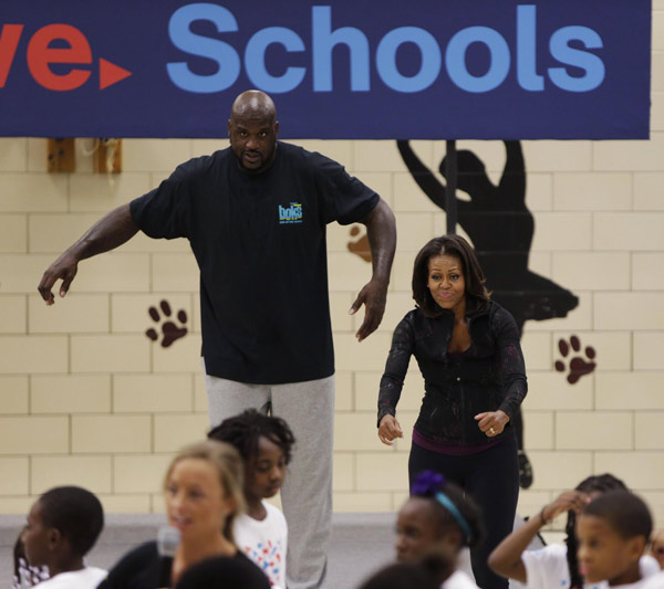 US First Lady joins O'Neal at back to school event