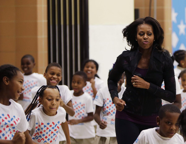 US First Lady joins O'Neal at back to school event