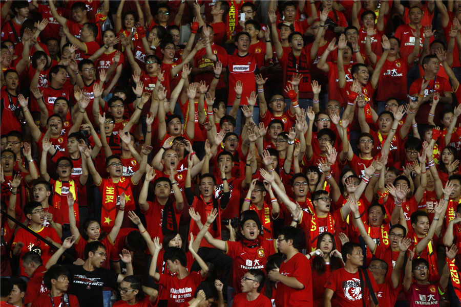 Football fans cheer for Guangzhou Evergrandeu